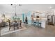 Open floor plan showcasing living room, kitchen, and dining area at 43620 Sparrow Dr, Punta Gorda, FL 33982