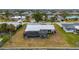 Aerial view showing home's pool, landscaping, and canal location at 450 Capri Isles Ct, Punta Gorda, FL 33950