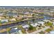 Wide aerial showcasing canal-front property and neighborhood at 450 Capri Isles Ct, Punta Gorda, FL 33950