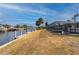 Waterfront backyard, offering serene canal views at 450 Capri Isles Ct, Punta Gorda, FL 33950