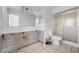 A bathroom with a shower, toilet, and double vanity at 450 Capri Isles Ct, Punta Gorda, FL 33950
