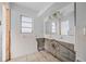 A bathroom with a shower and double vanity at 450 Capri Isles Ct, Punta Gorda, FL 33950