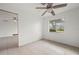 Bright bedroom featuring tile floors and a ceiling fan at 450 Capri Isles Ct, Punta Gorda, FL 33950