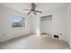 Simple bedroom with tile flooring, a ceiling fan, and a closet at 450 Capri Isles Ct, Punta Gorda, FL 33950