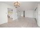 Dining room with tile floors and kitchen access at 450 Capri Isles Ct, Punta Gorda, FL 33950