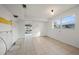 A bright kitchen with tile floors and a view to the backyard pool at 450 Capri Isles Ct, Punta Gorda, FL 33950