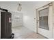 Small laundry room with water heater and exterior access at 450 Capri Isles Ct, Punta Gorda, FL 33950