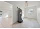 Unfinished laundry room with tile floor and water heater at 450 Capri Isles Ct, Punta Gorda, FL 33950