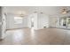 Living room with tile floors and access to other rooms at 450 Capri Isles Ct, Punta Gorda, FL 33950