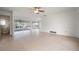 Bright living room with tile floors and sliding doors to the pool at 450 Capri Isles Ct, Punta Gorda, FL 33950