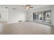 Living room featuring tile floors and large windows at 450 Capri Isles Ct, Punta Gorda, FL 33950