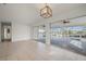 Living room with tile floors and pool access at 450 Capri Isles Ct, Punta Gorda, FL 33950