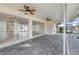 Covered patio with pavers and access to the pool at 450 Capri Isles Ct, Punta Gorda, FL 33950