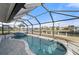 Enclosed pool and spa area with water views at 450 Capri Isles Ct, Punta Gorda, FL 33950