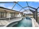 Inviting pool area with covered lanai and spa at 450 Capri Isles Ct, Punta Gorda, FL 33950