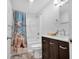 Clean bathroom with tub, shower, and dark vanity at 745 Kellstadt Nw St, Port Charlotte, FL 33952