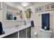 Bathroom with vanity, mirror, and shower at 745 Kellstadt Nw St, Port Charlotte, FL 33952