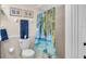 Clean bathroom with shower/tub and beach-themed decor at 745 Kellstadt Nw St, Port Charlotte, FL 33952