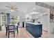 Bright kitchen with island, white cabinets, and dining area at 745 Kellstadt Nw St, Port Charlotte, FL 33952
