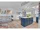 Modern kitchen with blue cabinetry, white countertops, and an island at 745 Kellstadt Nw St, Port Charlotte, FL 33952