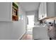 Laundry room with washer, dryer, and extra storage at 745 Kellstadt Nw St, Port Charlotte, FL 33952