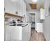 Bright laundry room, featuring washer, dryer, and ample storage at 745 Kellstadt Nw St, Port Charlotte, FL 33952