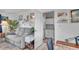 Cozy living room with a comfortable couch and built-in shelving at 745 Kellstadt Nw St, Port Charlotte, FL 33952