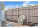 Private patio with wicker chairs and wood fence at 745 Kellstadt Nw St, Port Charlotte, FL 33952