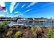 Boat lift and lush landscaping at a canal-front property at 805 Brenda Ct, Punta Gorda, FL 33950