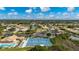 Aerial view of community amenities including tennis courts, pool, and clubhouse at 8326 Creekview Ln, Englewood, FL 34224