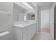 Bathroom with white vanity, quartz countertop, and tiled floor at 8326 Creekview Ln, Englewood, FL 34224