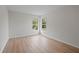 Spacious bedroom with light walls and wood-look flooring at 8326 Creekview Ln, Englewood, FL 34224