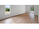 Spacious bedroom with large window and sliding glass doors to backyard at 8326 Creekview Ln, Englewood, FL 34224