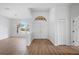 Bright and airy entryway with hardwood floors at 8326 Creekview Ln, Englewood, FL 34224