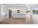 Modern kitchen with island and view of pool at 8326 Creekview Ln, Englewood, FL 34224