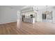 Spacious kitchen featuring modern white cabinets, stainless steel appliances, and a large island at 8326 Creekview Ln, Englewood, FL 34224