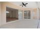 Spacious lanai with sliding doors, ceiling fan, and pool access at 8326 Creekview Ln, Englewood, FL 34224