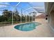Inviting kidney-shaped pool with screened enclosure at 8326 Creekview Ln, Englewood, FL 34224
