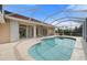 Screened pool area with view of home's interior at 8326 Creekview Ln, Englewood, FL 34224