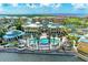 Resort-style pool and community building with palm trees at 87 Vivante Blvd # 403, Punta Gorda, FL 33950