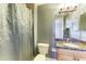 Clean bathroom with granite vanity and shower at 87 Vivante Blvd # 403, Punta Gorda, FL 33950