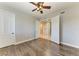 Spacious bedroom with wood floors and access to hallway at 87 Vivante Blvd # 403, Punta Gorda, FL 33950