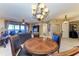 Round dining table with seating for four, adjacent to kitchen at 87 Vivante Blvd # 403, Punta Gorda, FL 33950
