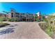 Luxury condo building with Mediterranean architecture and paved courtyard at 87 Vivante Blvd # 403, Punta Gorda, FL 33950