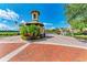 Gated community entrance with a charming, detailed guard house at 87 Vivante Blvd # 403, Punta Gorda, FL 33950