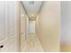 Light and airy hallway with neutral walls and hardwood floors at 87 Vivante Blvd # 403, Punta Gorda, FL 33950