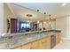 Granite countertops and stainless steel appliances highlight this kitchen at 87 Vivante Blvd # 403, Punta Gorda, FL 33950