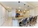 Modern kitchen with granite countertops and a breakfast bar at 87 Vivante Blvd # 403, Punta Gorda, FL 33950