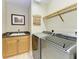 Laundry room with washer, dryer, and cabinets at 87 Vivante Blvd # 403, Punta Gorda, FL 33950