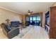 Bright living room featuring hardwood floors and stunning ocean views at 87 Vivante Blvd # 403, Punta Gorda, FL 33950